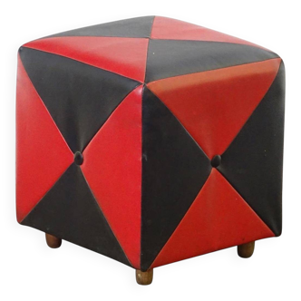 Mid-century ottoman stool in red and black faux leather with wooden legs.