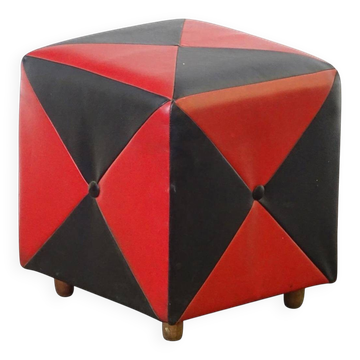 Mid-century ottoman stool in red and black faux leather with wooden legs.