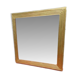Wooden mirror and gold trim