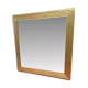 Wooden mirror and gold trim