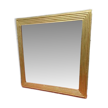 Wooden mirror and gold trim
