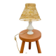 White porcelain table lamp and vintage raffia lampshade