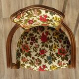 Convertible armchair with brocade fabric and floral patterns.