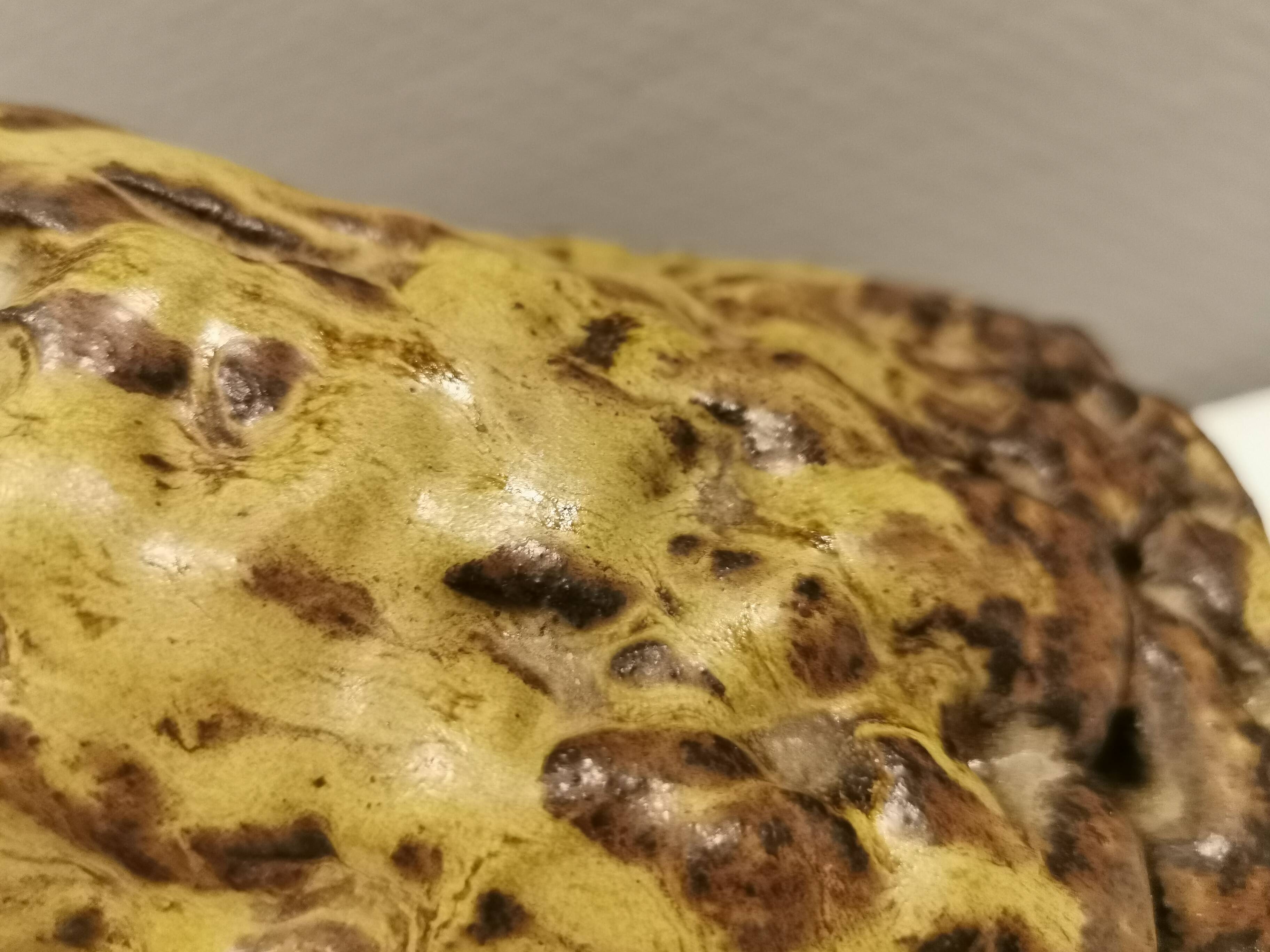 Ceramic table lamp, in greenish/brownish glaze, almost in the shape of a volcano.