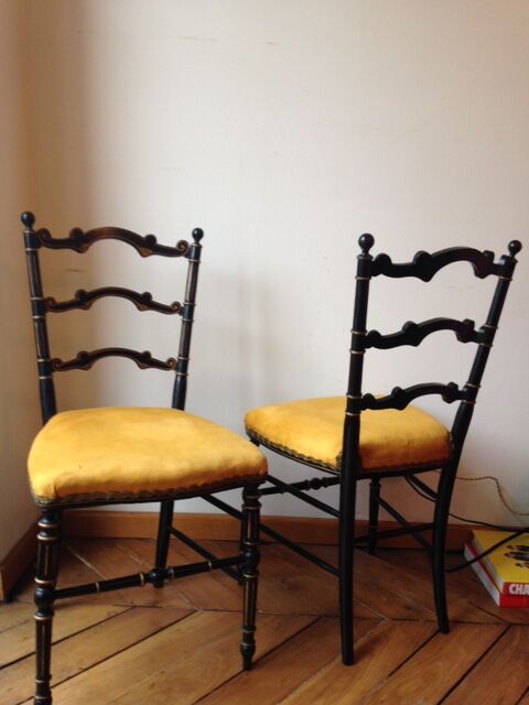 Pair of black and gold chairs