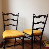 Paire de chaises noir et or