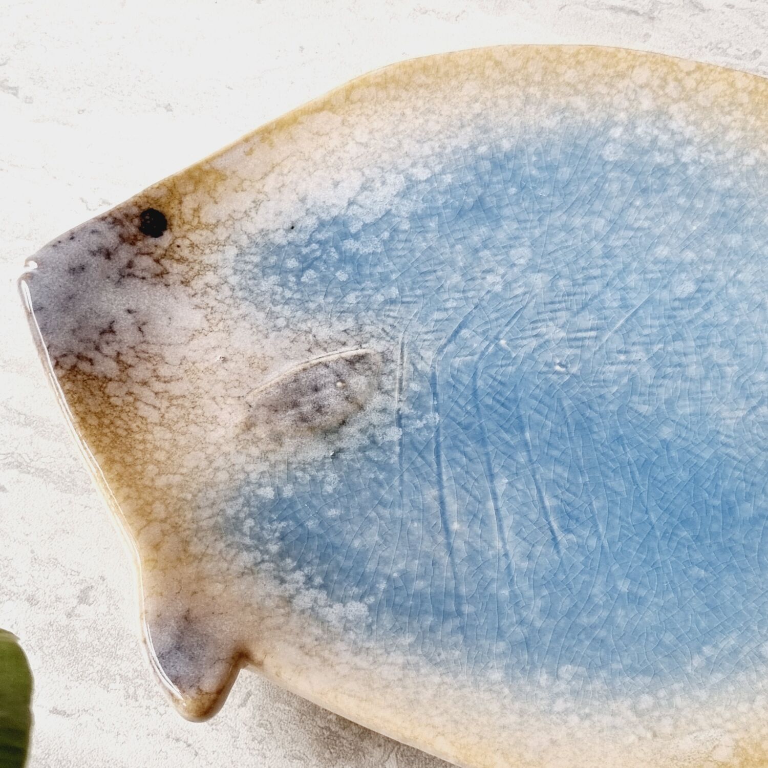 2 empty ceramic fish pockets