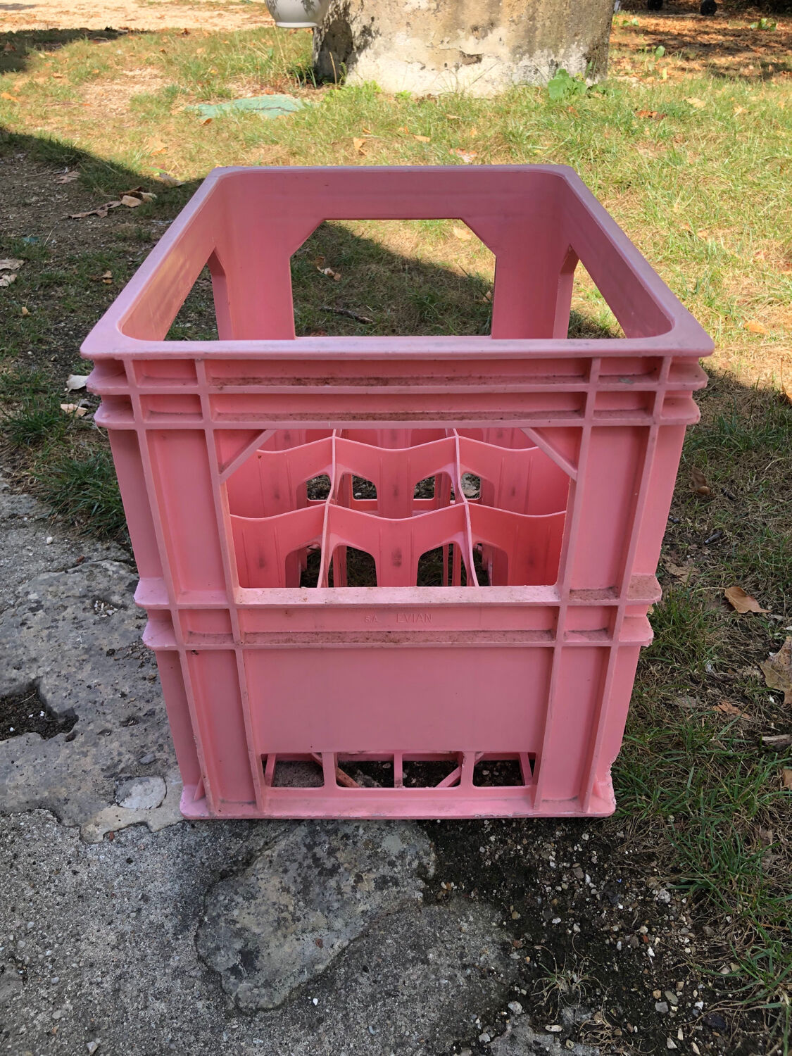 Evian bottle holder in pink plastic