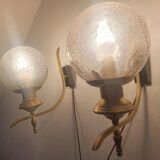 Pair of vintage gold wall sconces with transparent globes