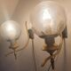 Pair of vintage gold wall sconces with transparent globes