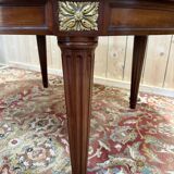 Oval dining table in Louis XVI style made of mahogany.
