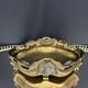 Art Nouveau jardinière in gilded bronze with holly decoration, signed E. Gros.