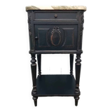 Romantic black bedside table with patinated marble and wood