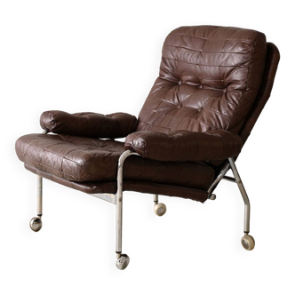 Leather armchair with metal legs