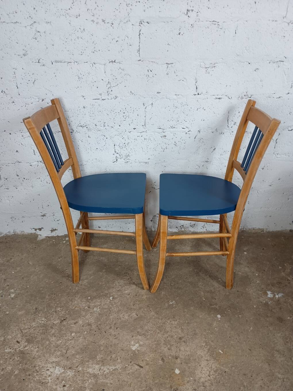 Two refurbished bistro chairs
