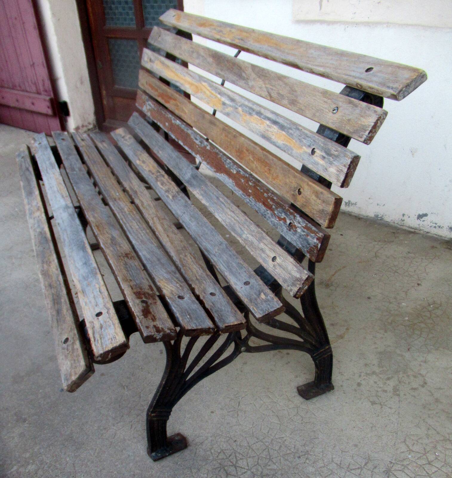 Small garden bench, with cast iron legs.