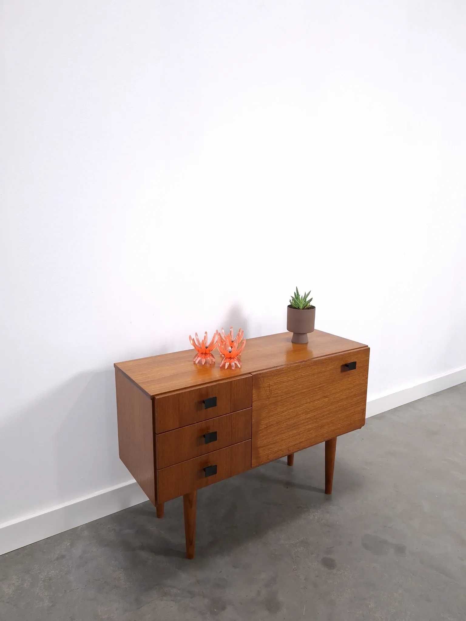 Vintage small teak cabinet with drawers, flap and black handles, hallway cabinet.