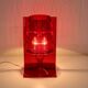 Red plastic Kartell table lamp - model Take - design by Ferruccio Laviani