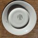 Pair of white porcelain cups from ADP France with a floral pattern and their s