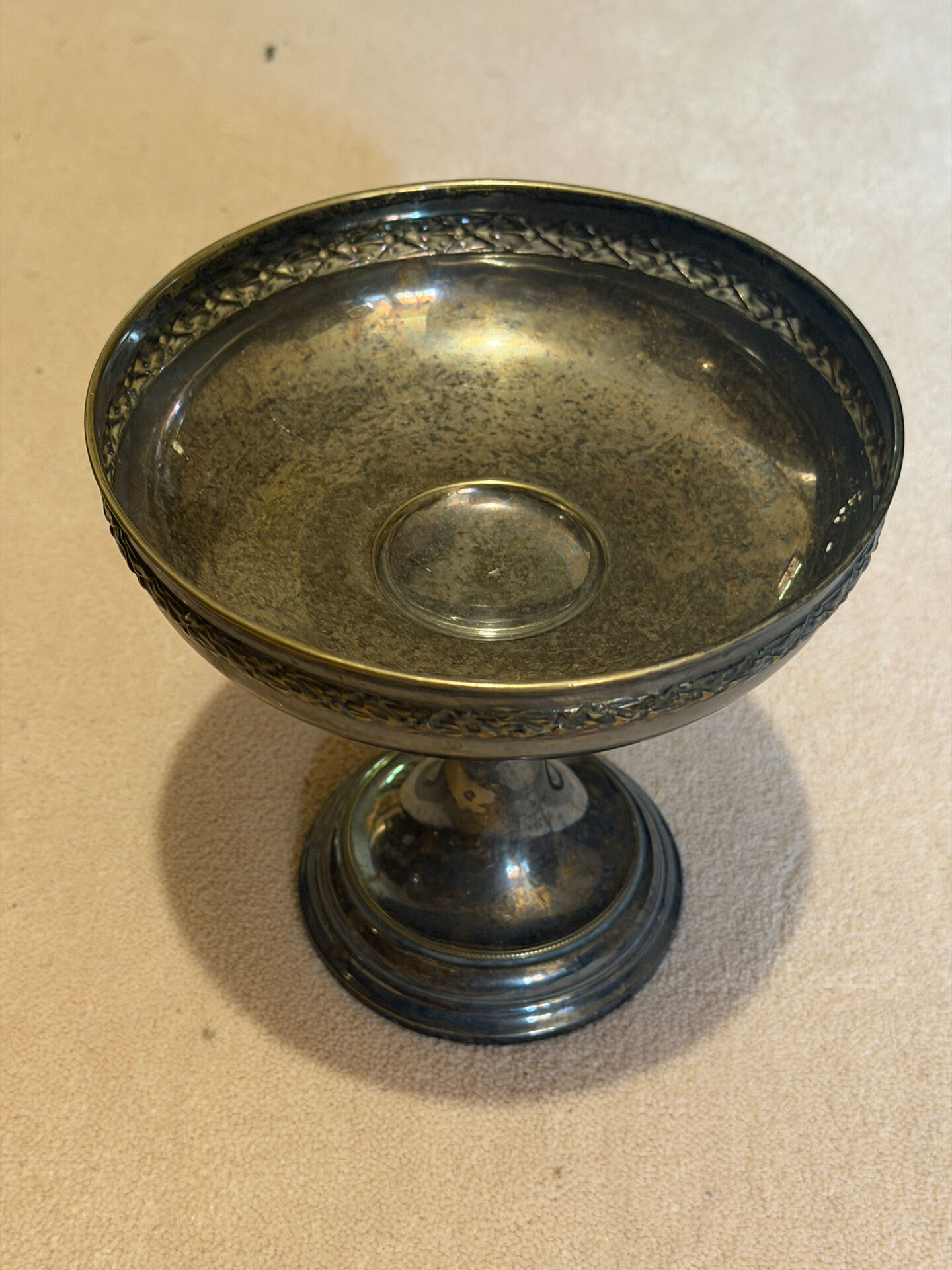 Vintage coupe on a patinated silver-plated metal stand.