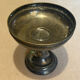 Vintage coupe on a patinated silver-plated metal stand.