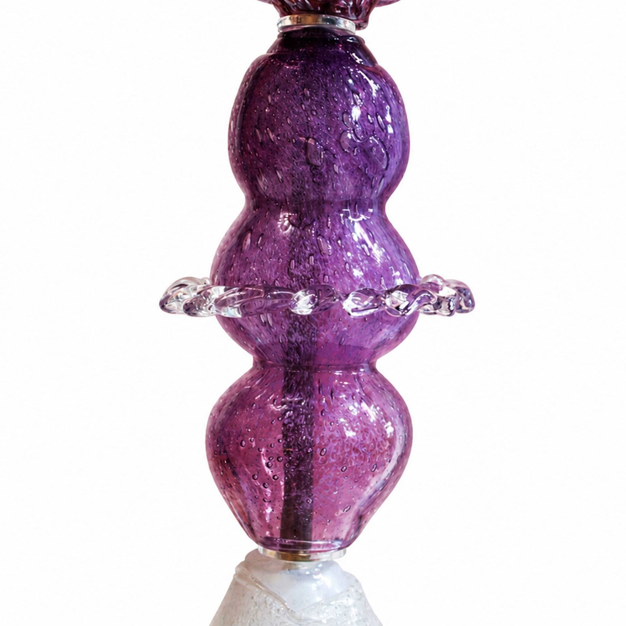 Set of three sculptural multicoloured glass floor lamps in a modernist style.