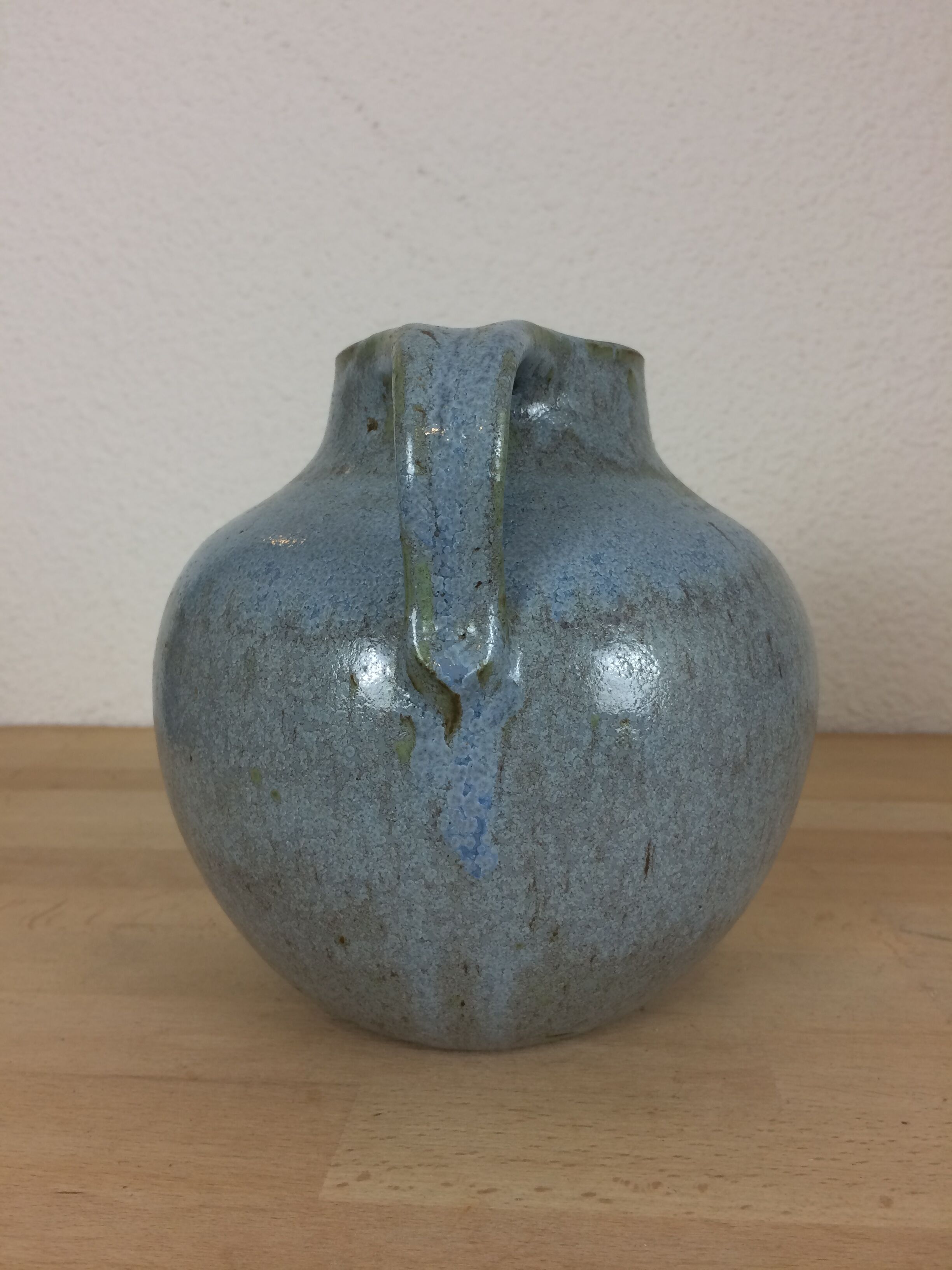 Blue ceramic ball vase signed