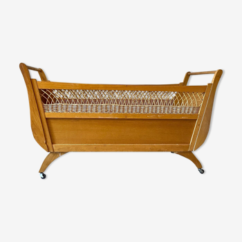 Children's bed in wood and wicker woven on wheels 1960