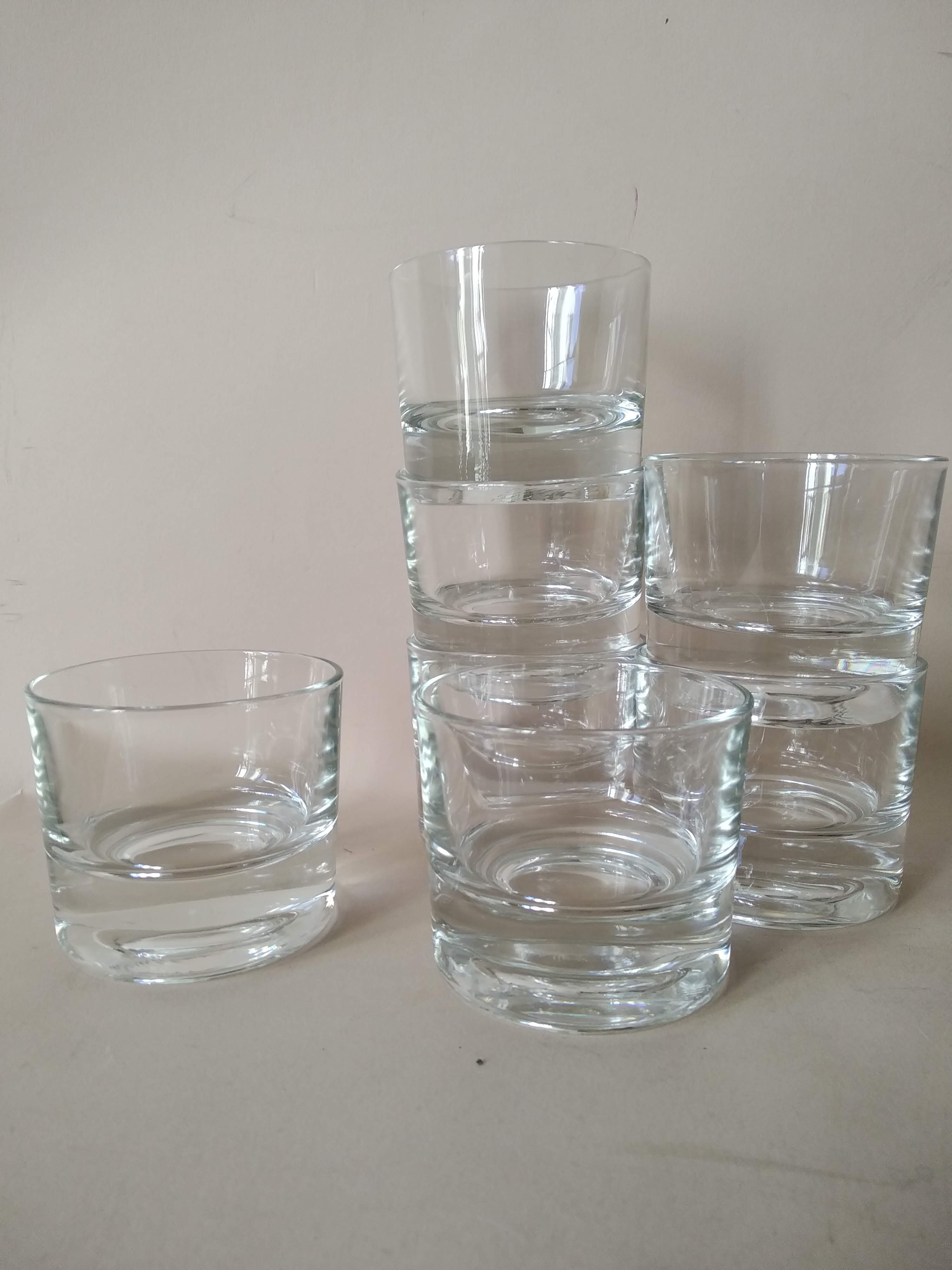 Glasses cups with thick bottom with water or vintage spirits 70