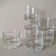 Glasses cups with thick bottom with water or vintage spirits 70