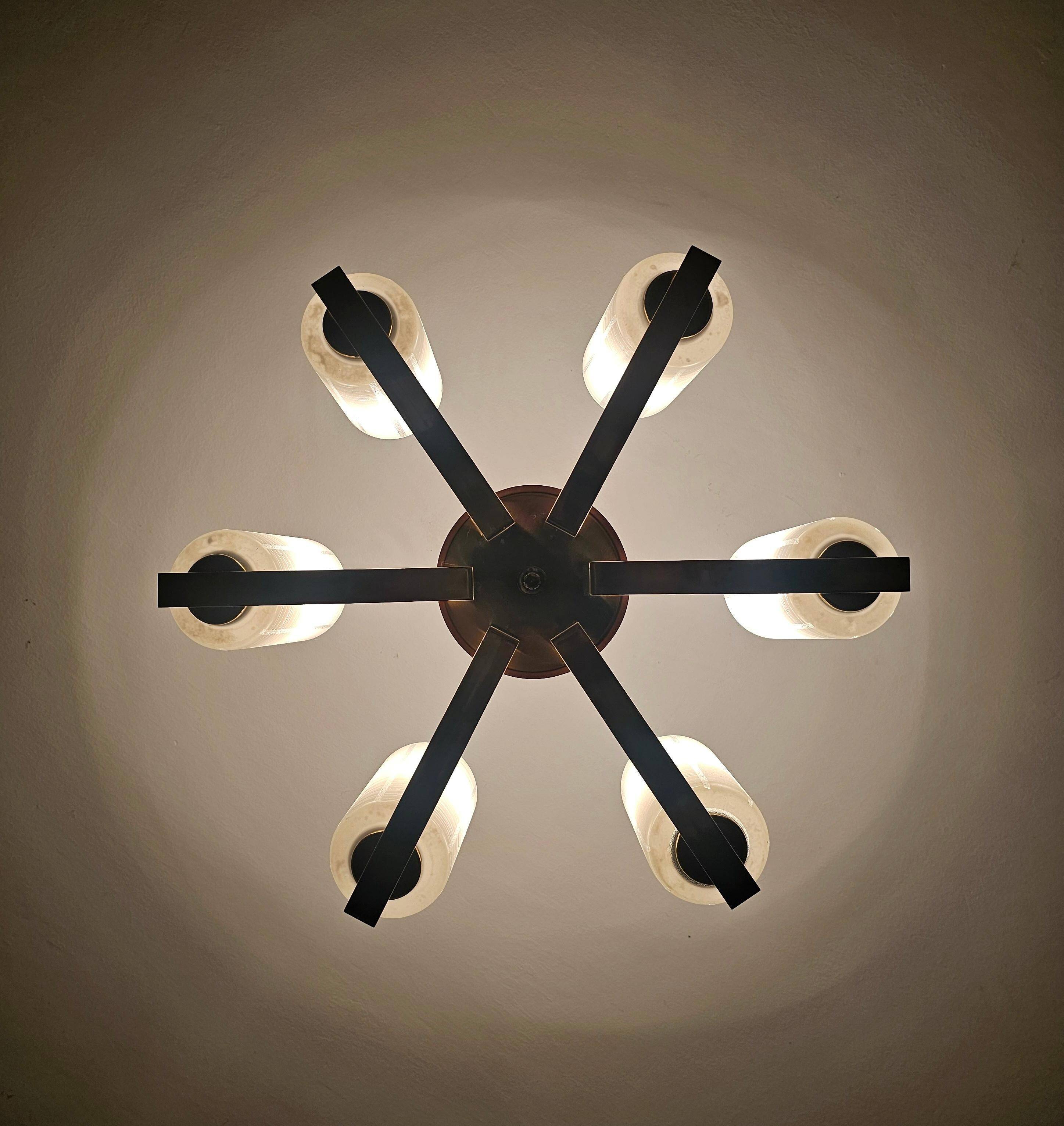 Lustre Mid Century Modern with 6 brass arms, teak, and frosted glass.
