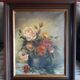 Antique oil painting depicting a bouquet of roses