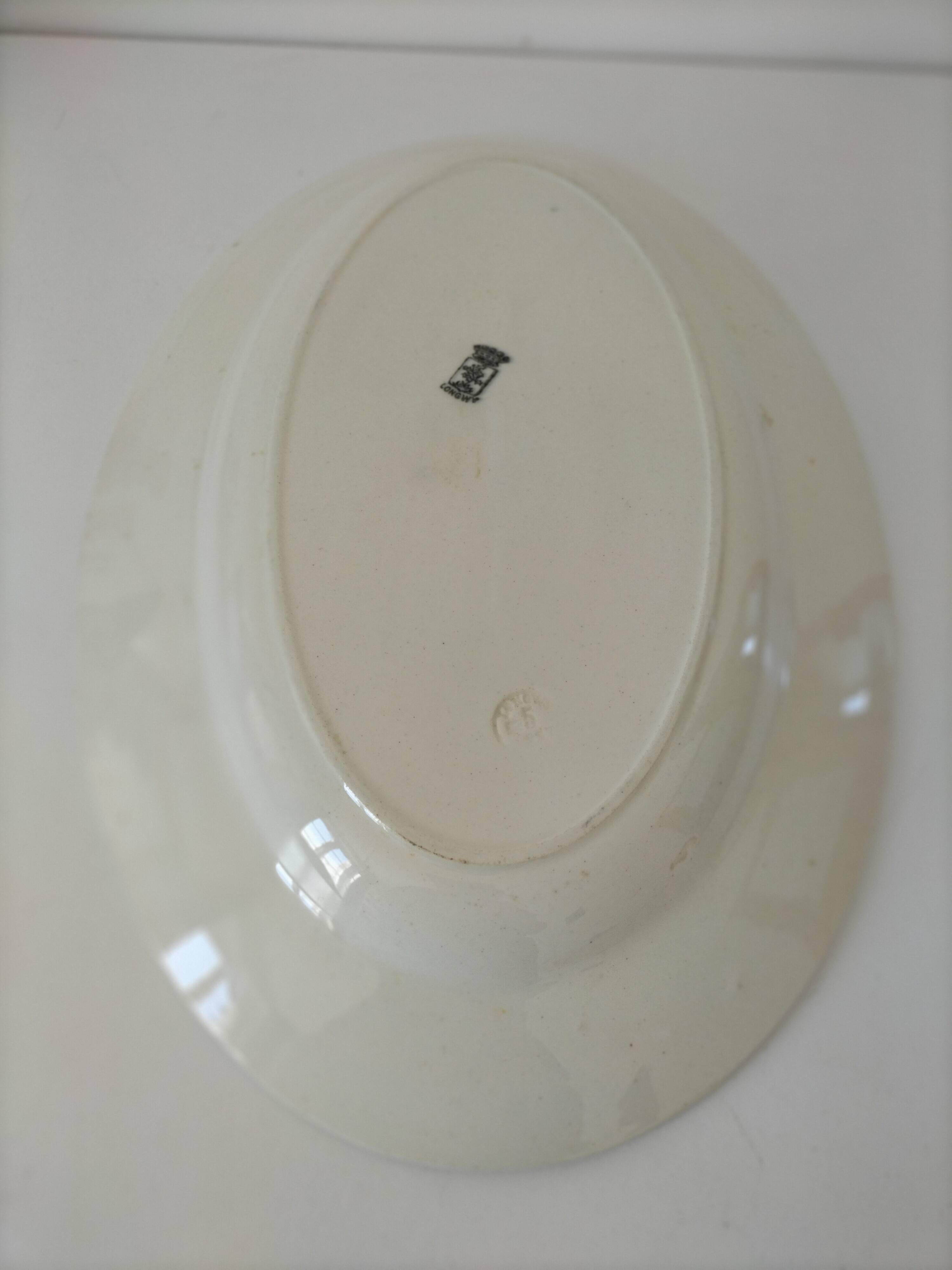 Oval Art Deco plate from Longwy pottery.