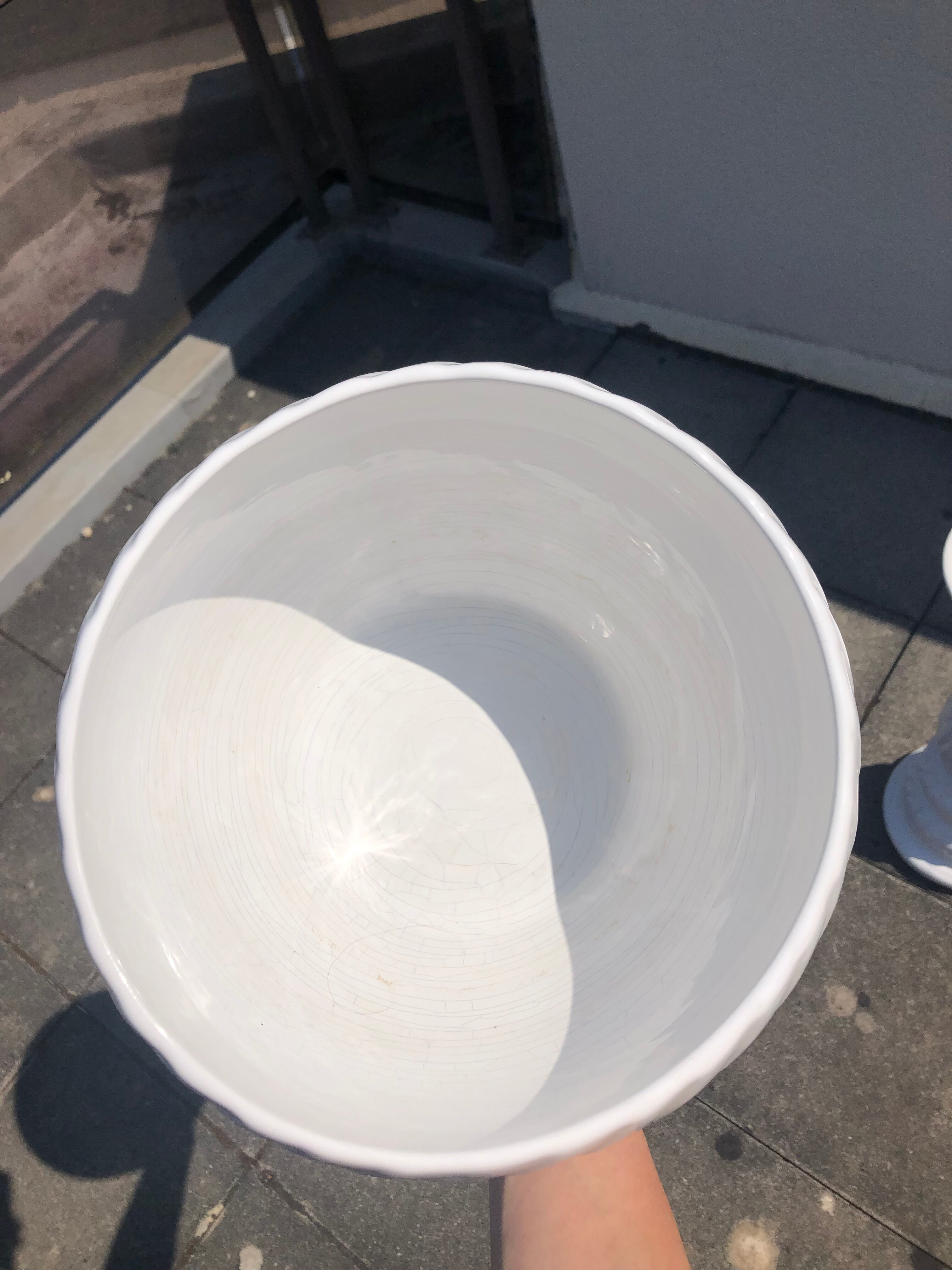 Column and white earthenware pot cover