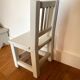 Small children's chair in antique white wood.
