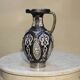 A jar of water pitcher made of tamgroute pottery handmade and adorned with bones.