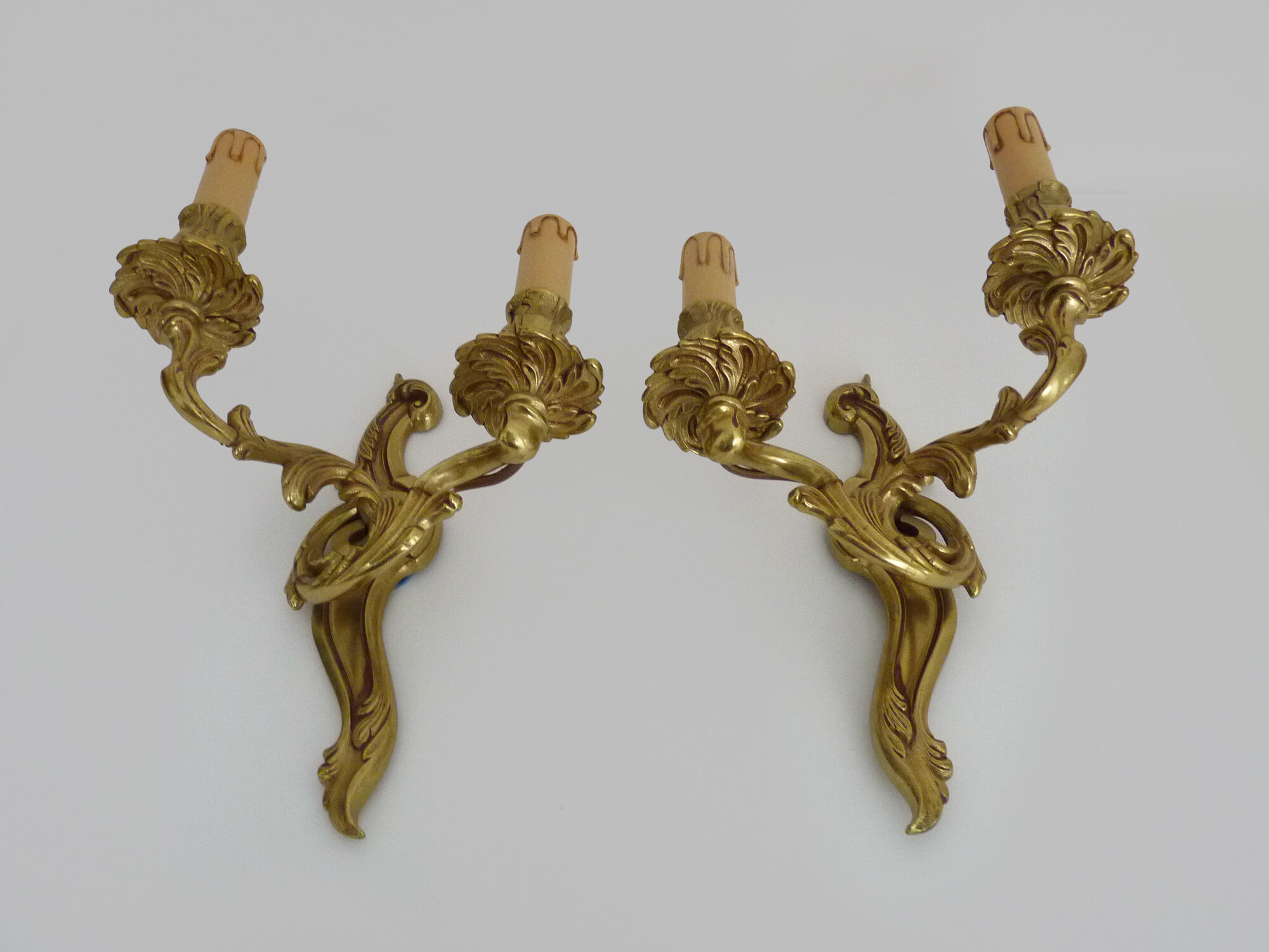 Old pair of wall sconces with double fires in bronze, 50s