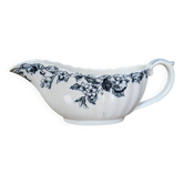 Antique sauce boat in earthenware with floral decoration.