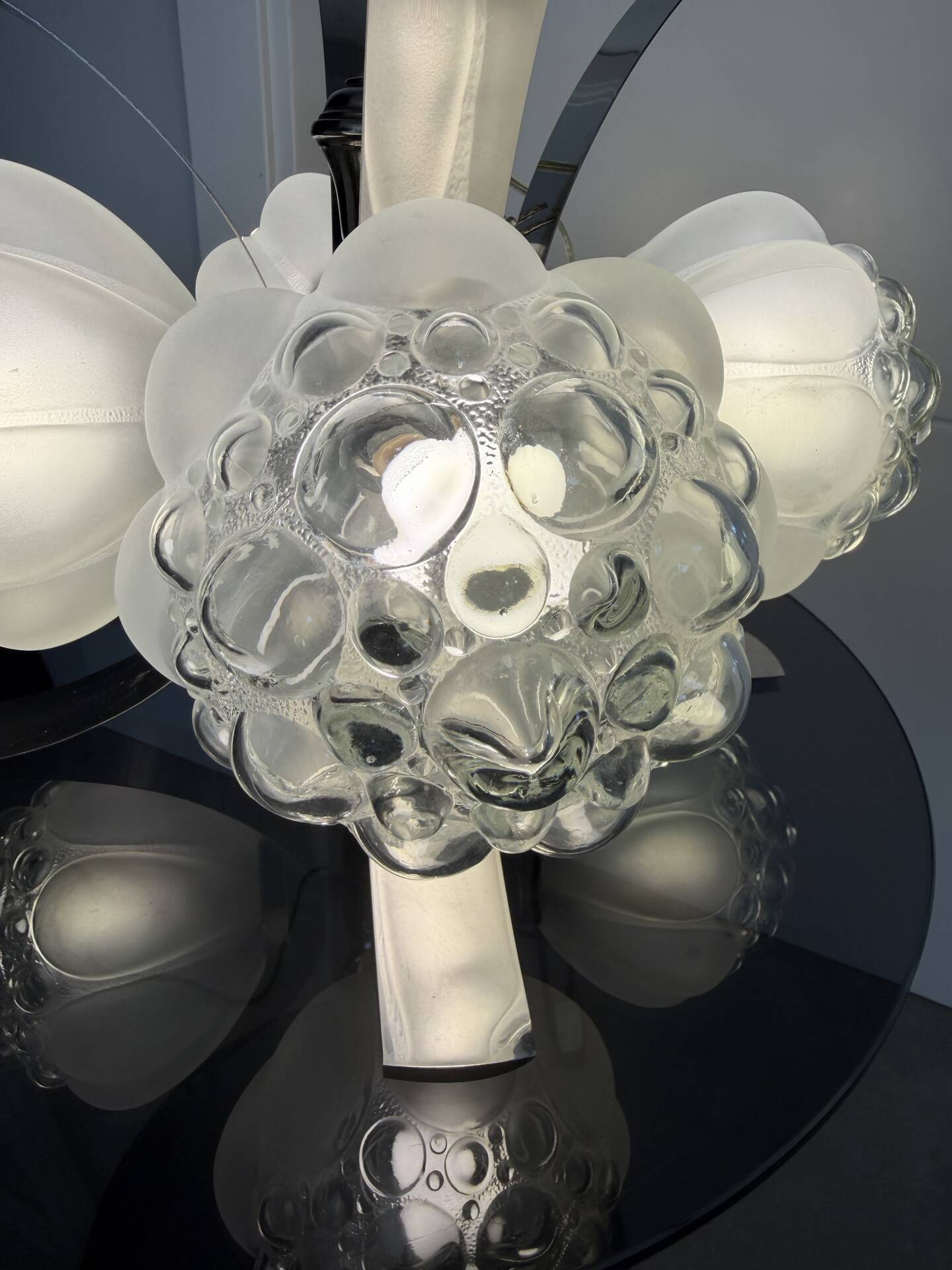 Vintage chandelier with 4 glass bubble globes and silvered metal.