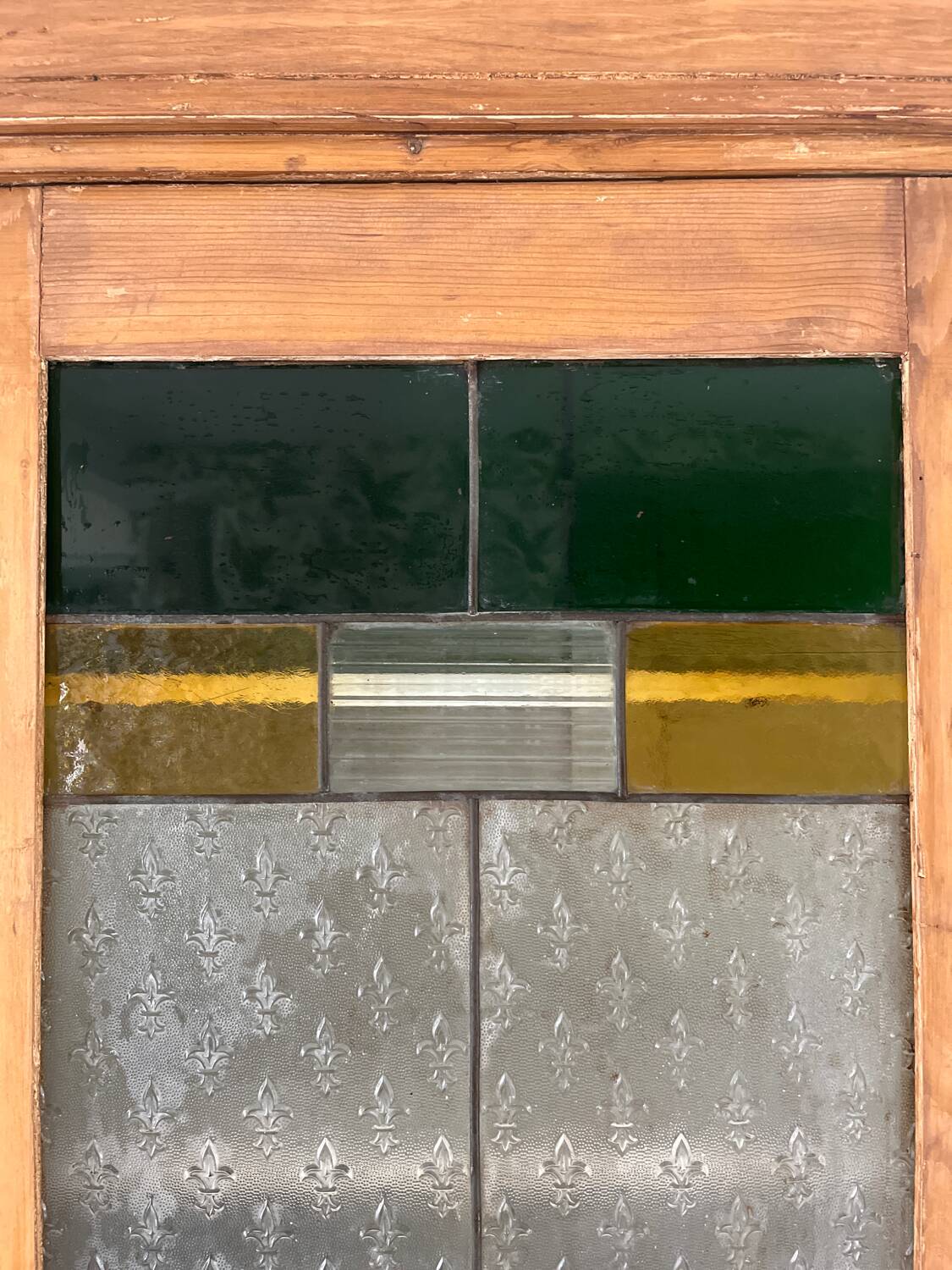 Antique dresser with glass doors and fleur-de-lys from the 50s