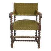 Antique armchair, Louis XIII style, in turned, carved wood, seat and back in green velvet.