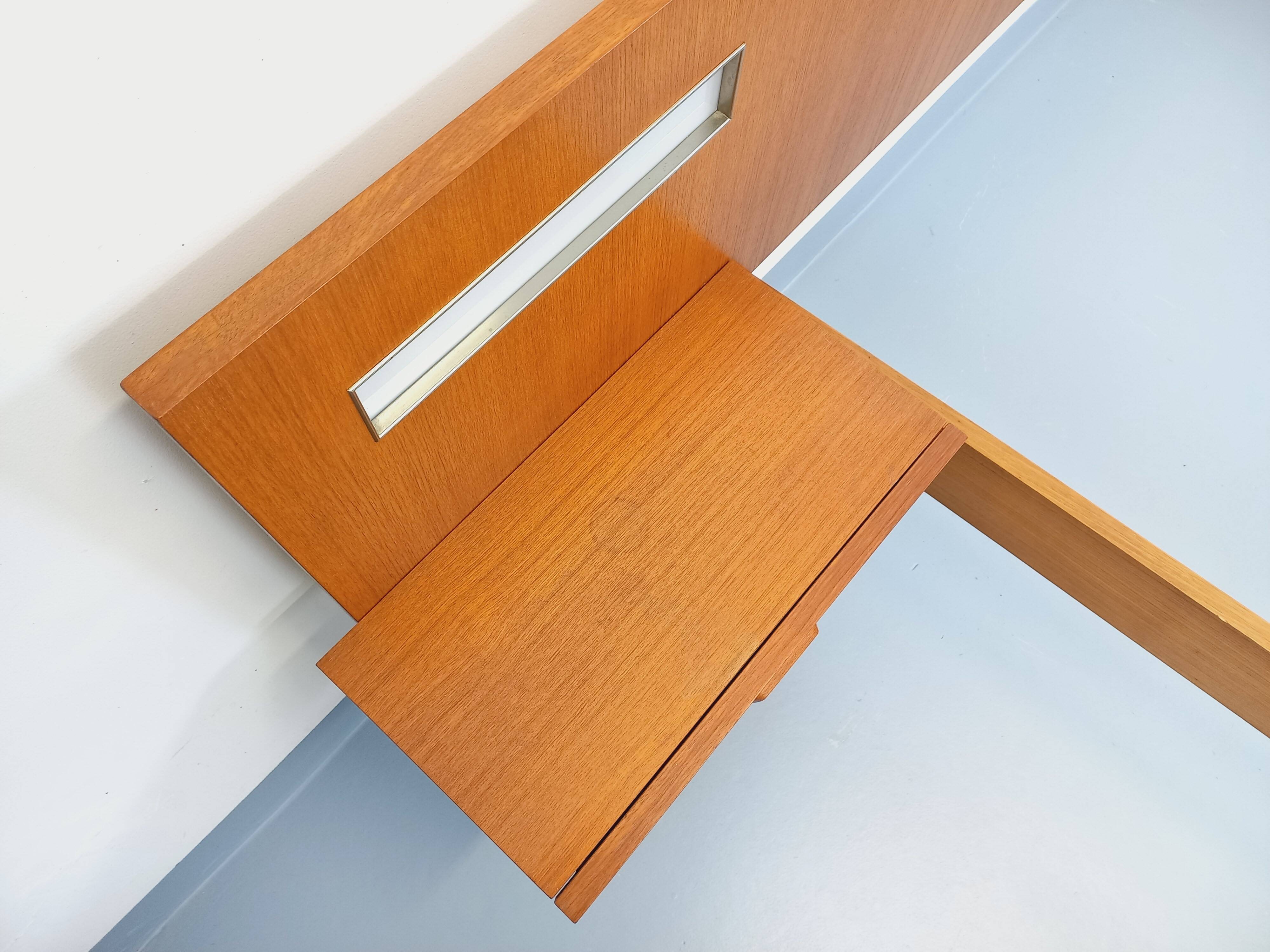 Double bed in vintage Scandinavian style from the 1960s with bedside tables.