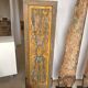 Rectangular Indonesian construction element with blue and yellow plant in carved wood