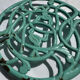 Enamelled cast iron trivet in blue with wrought iron decoration.