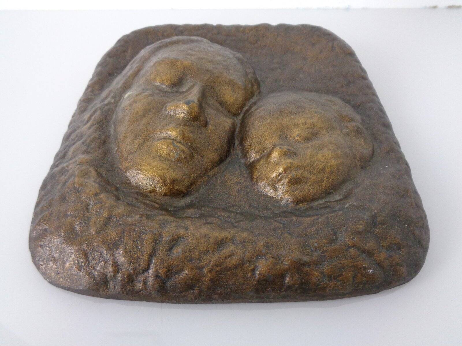 German bronze relief of mother with baby, 1940s.