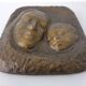 German bronze relief of mother with baby, 1940s.