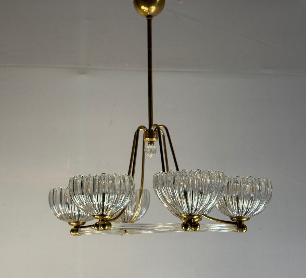 Venetian chandelier in colourless Murano glass and brass, circa 1940.