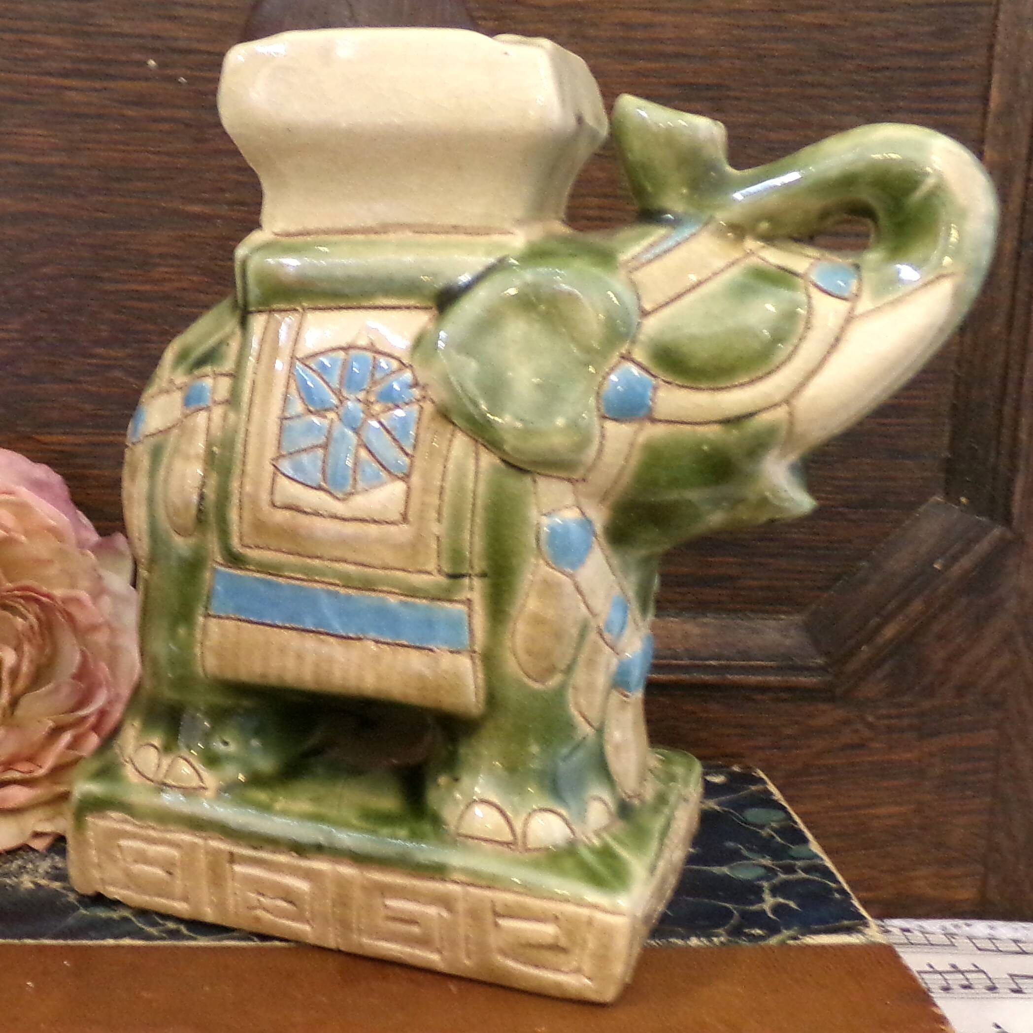 Small green ceramic elephant vase