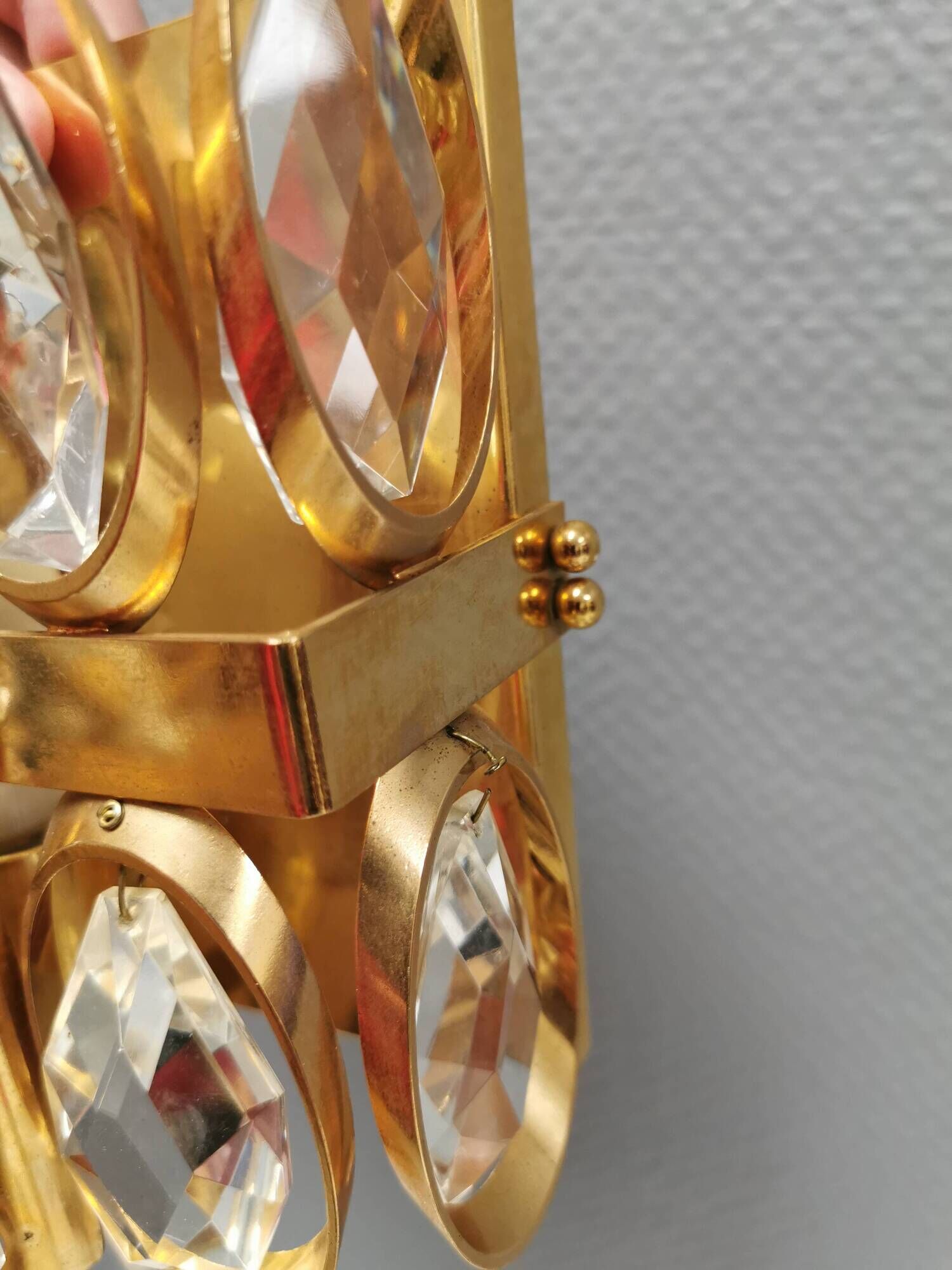 Swedish wall lamp in gold-colored metal with glass prisms. Estimated 1970-80s.