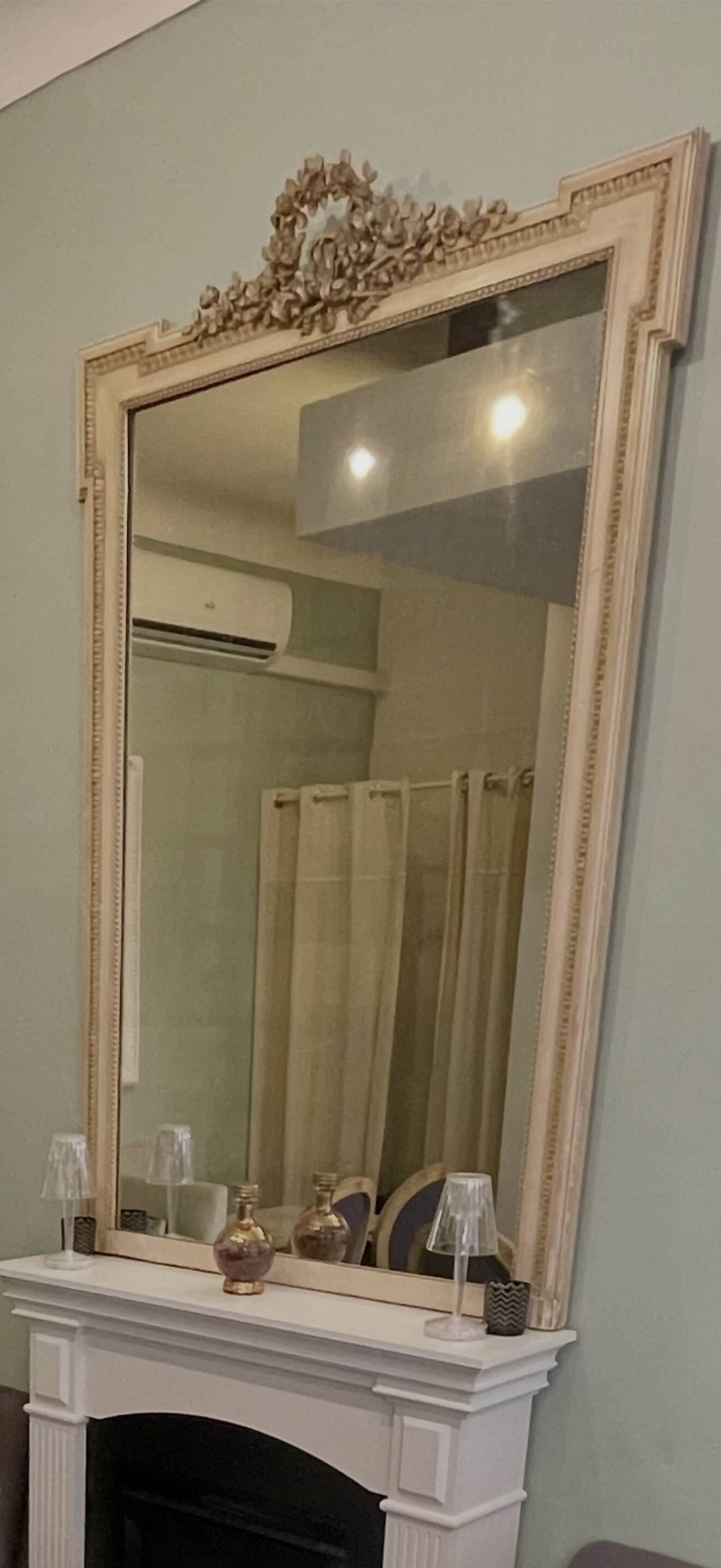 large antique mirror with richly carved pediment in Louis XV / Napoleon style